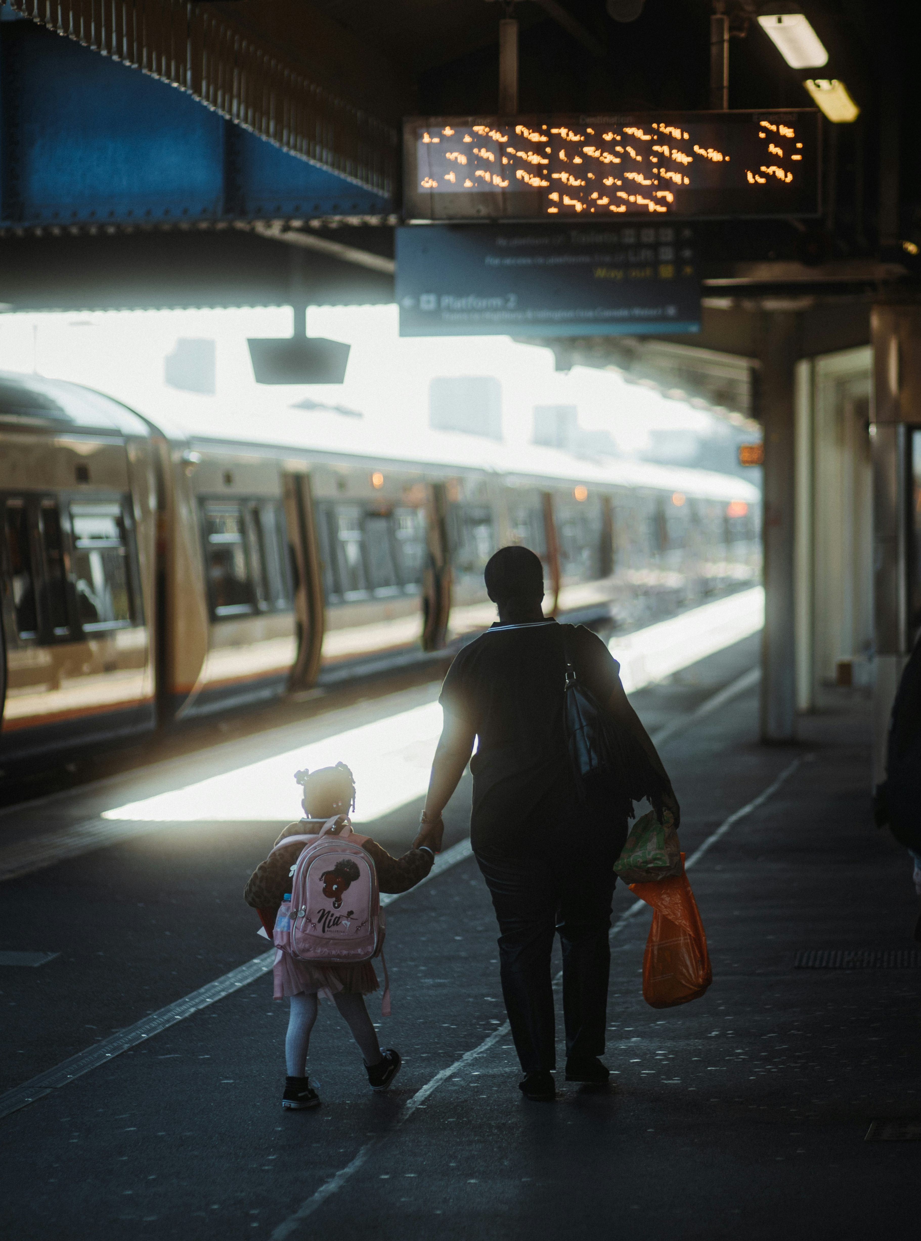 Happy family at train station